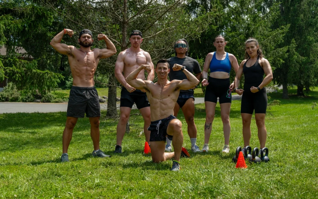 fitness enthusiasts pose for a photo outside