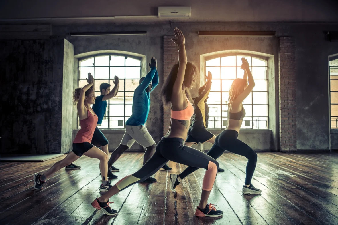 women and men in a group fitness class