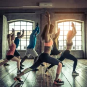 women and men in a group fitness class