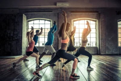 women and men in a group fitness class