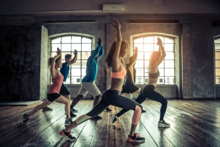women and men in a group fitness class