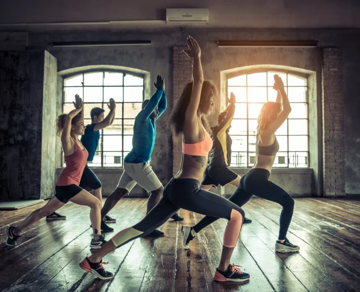 women and men in a group fitness class