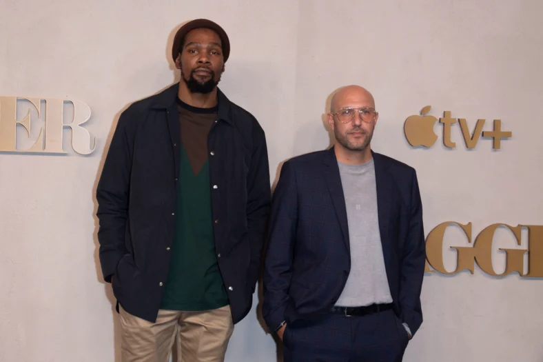 Kevin Durant and Rich Kleiman on a step and repeat.