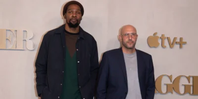 Kevin Durant and Rich Kleiman on a step and repeat.