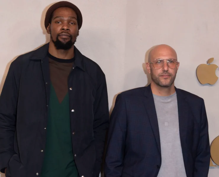 Kevin Durant and Rich Kleiman on a step and repeat.