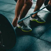 person about to lift weighted barbell