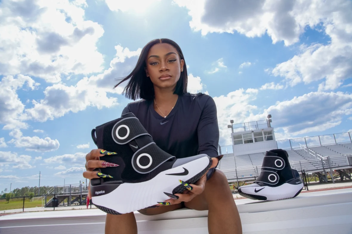 Sha'Carri Richardson holds a Hyperboot