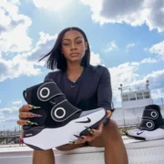 Sha'Carri Richardson holds a Hyperboot