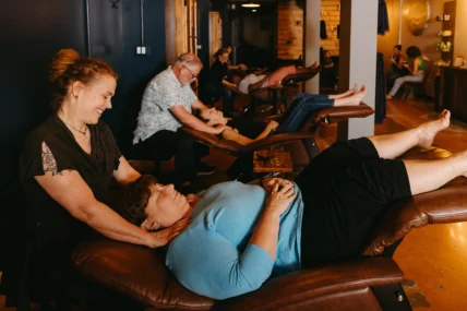a woman receiving a massage at Relax and Unwind Social Spa