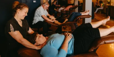 a woman receiving a massage at Relax and Unwind Social Spa