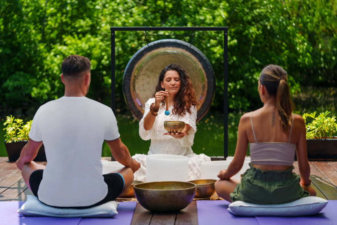 A couple participating in a sound healing session.