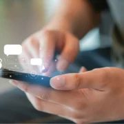 Person with phone interacting with AI icons