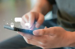 Person with phone interacting with AI icons