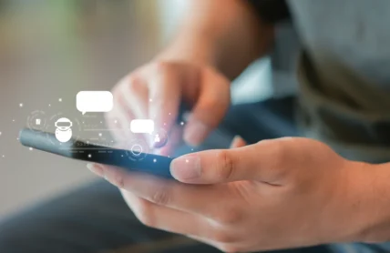 Person with phone interacting with AI icons