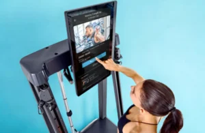 a woman using an Echelon fitness system