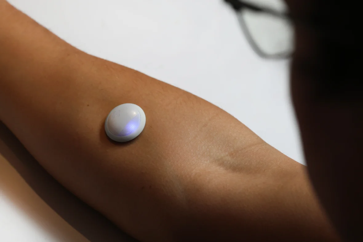 A woman wearing a Biolinq wearable.