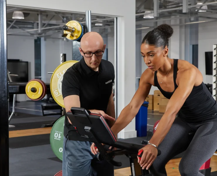 Trainer with client on Wattbike