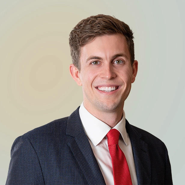A smiling headshot of Kyle Perreira.