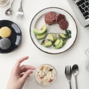 Person eating at laptop