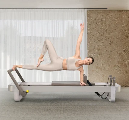 A woman on a new Technogym Reform, a Pilates Reformer.