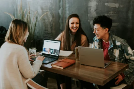 young people at work in front of laptops.