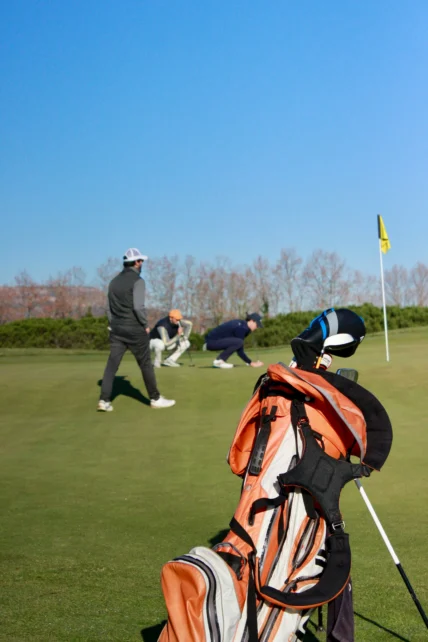 Golfers on the green.