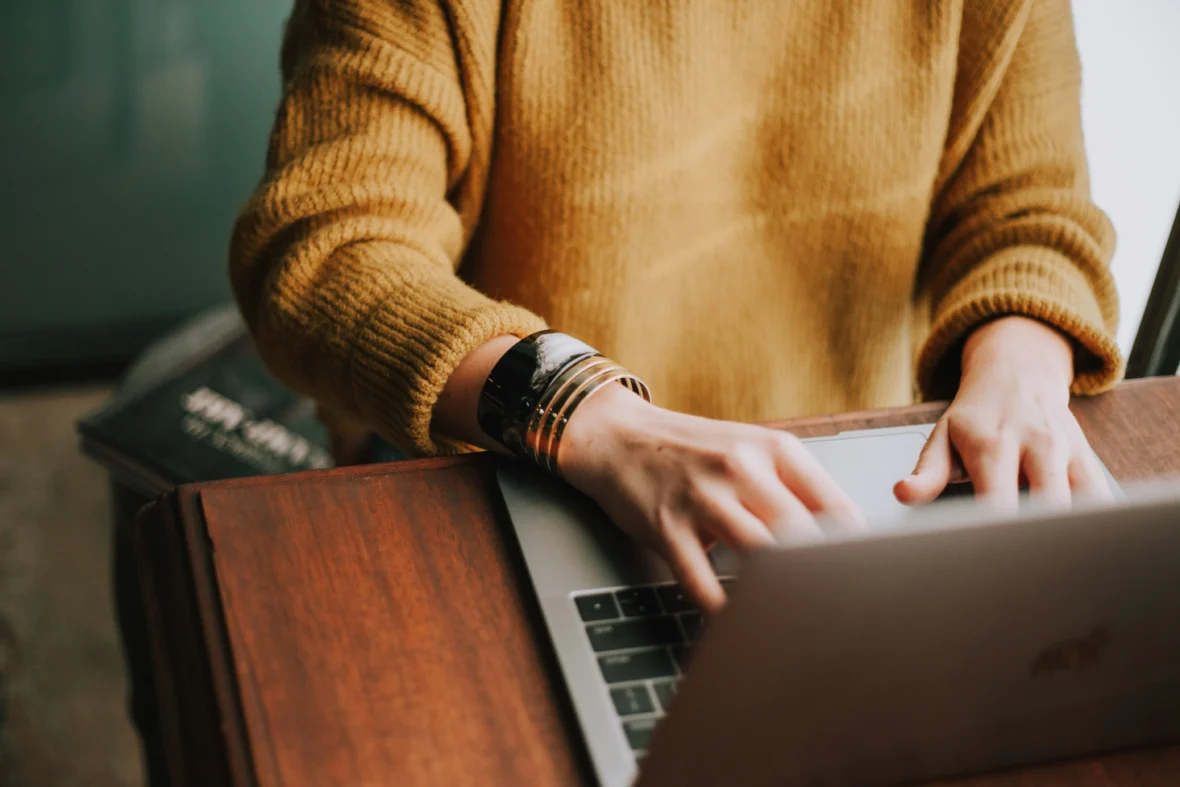 a woman behind a computer.