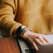 a woman behind a computer.
