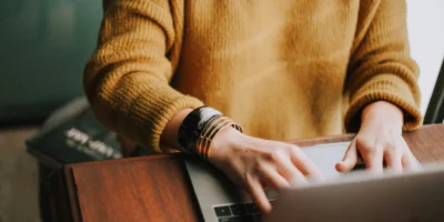 a woman behind a computer.