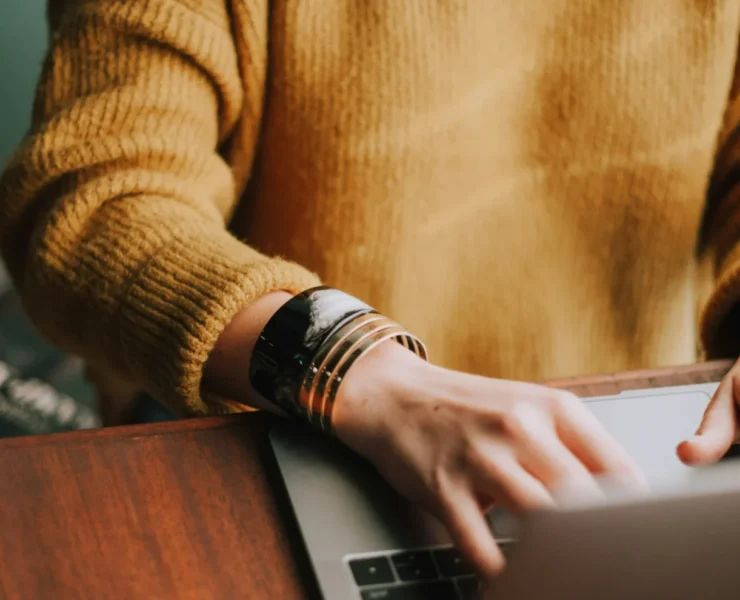 a woman behind a computer.
