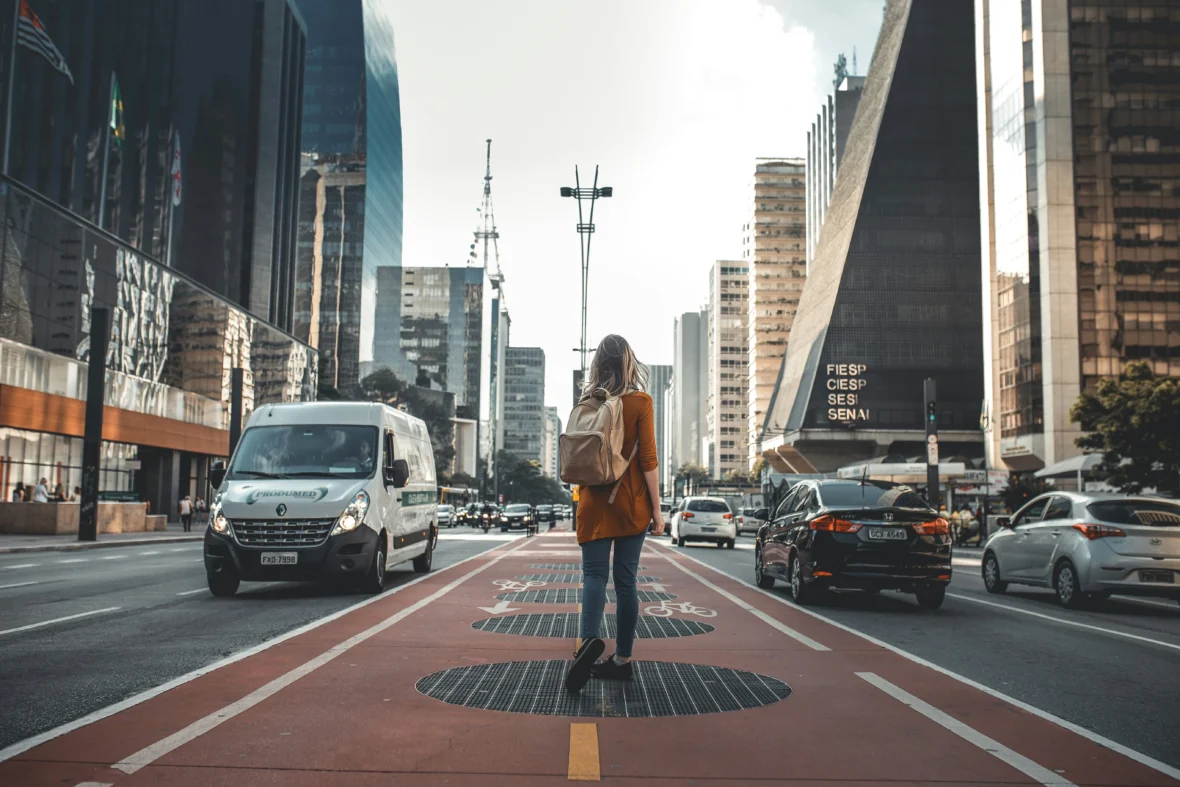 A woman traveler wearing a backpack.