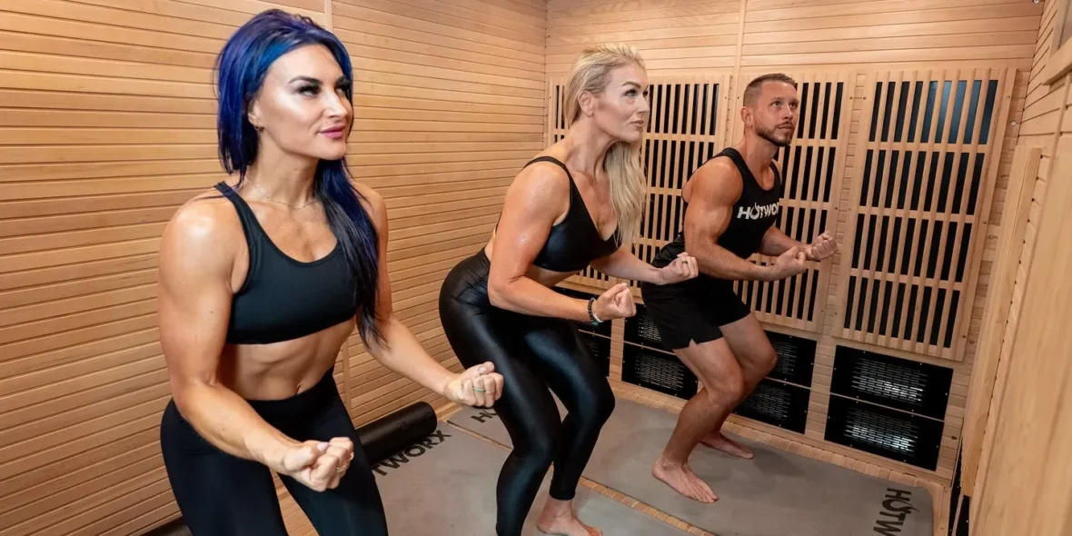 three people exercising in a Hotworx faclity