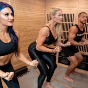three people exercising in a Hotworx faclity