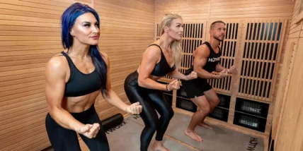 three people exercising in a Hotworx faclity