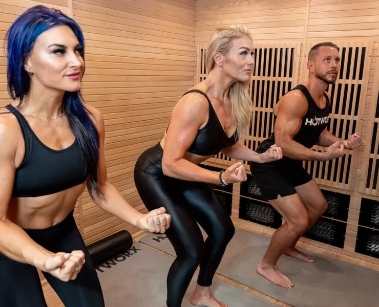 three people exercising in a Hotworx faclity