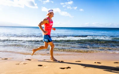 man runs on the beach
