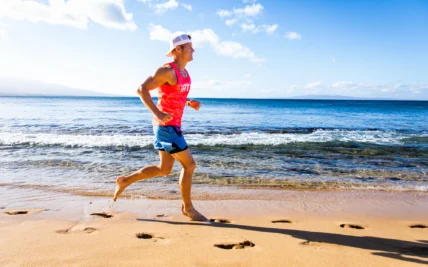 man runs on the beach