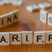 Scrabble pieces spelling out 'TARIFFS'