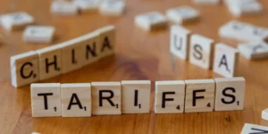 Scrabble pieces spelling out 'TARIFFS'