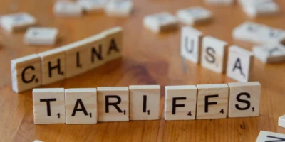 Scrabble pieces spelling out 'TARIFFS'