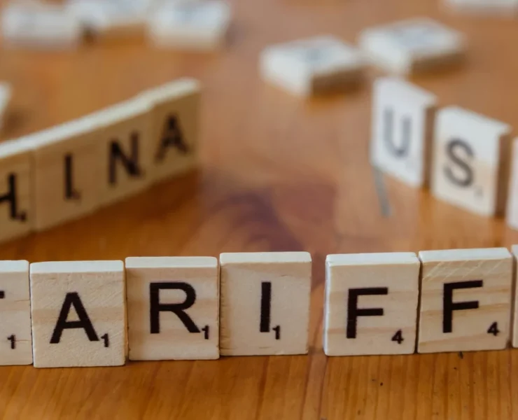 Scrabble pieces spelling out 'TARIFFS'