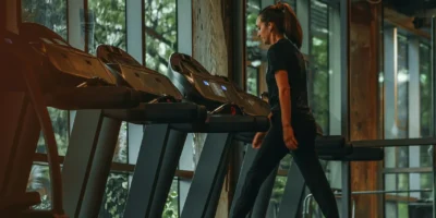 A woman walking on a treadmill.