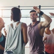 people high five after group fitness workout