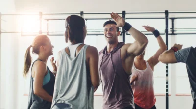people high five after group fitness workout