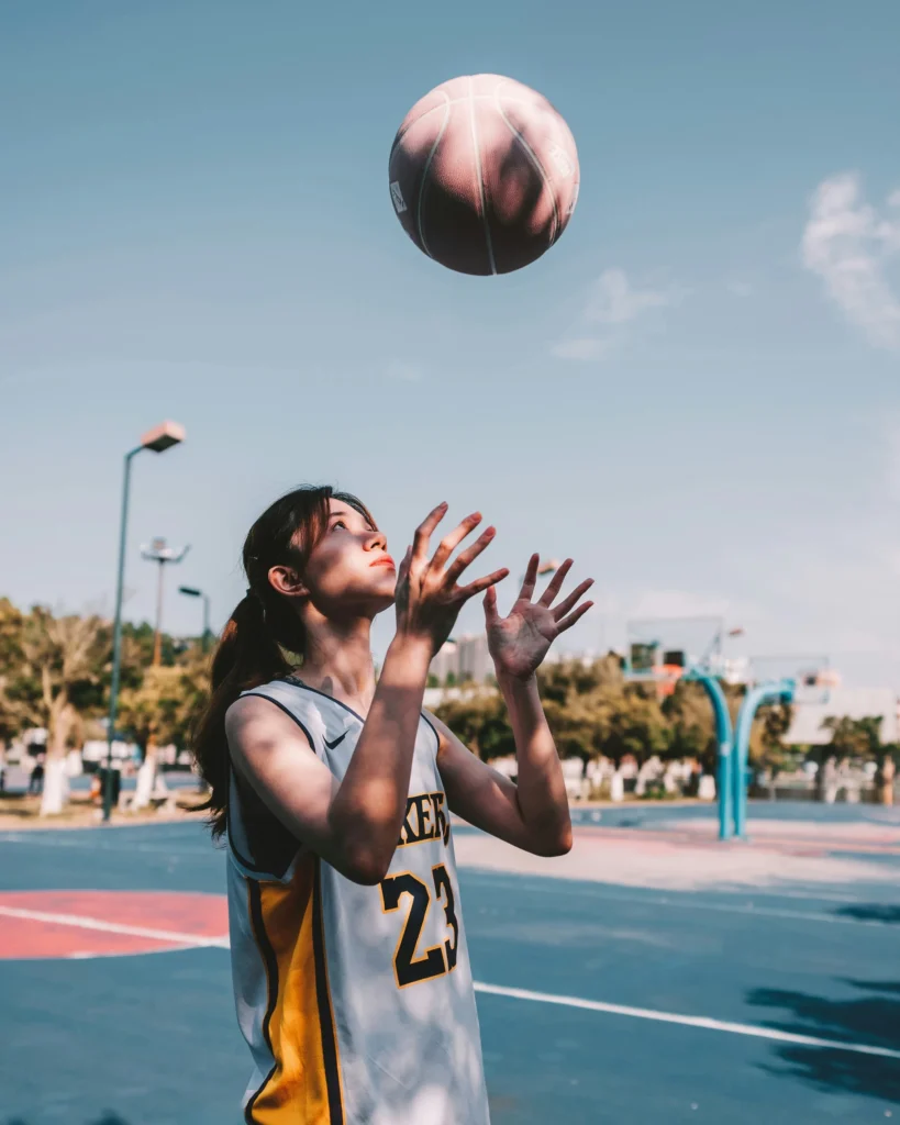 a woman and a basketball.