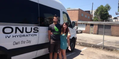 Onus IV Therapy + Longevity people in front of van