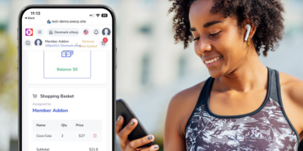 a woman looking at Exerp technology on her phone