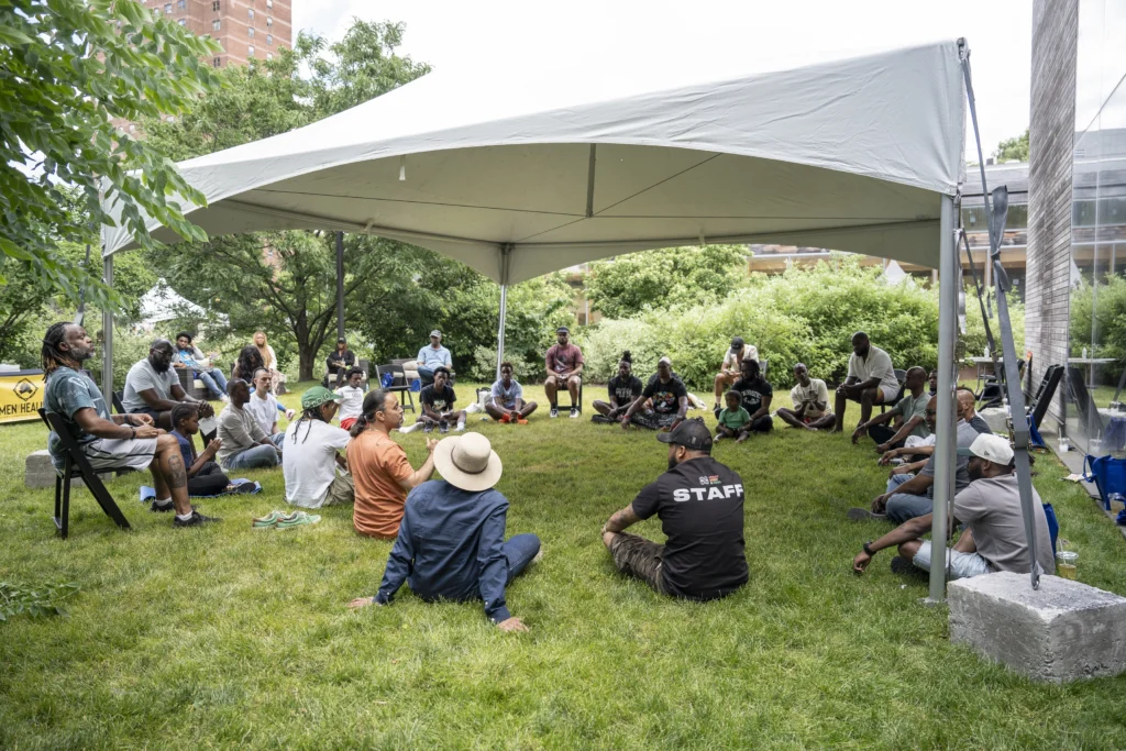 a group of peoplemeditating at Black Man’s Health Festival
