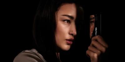 A woman staring at the Atlas credit card in her hand.