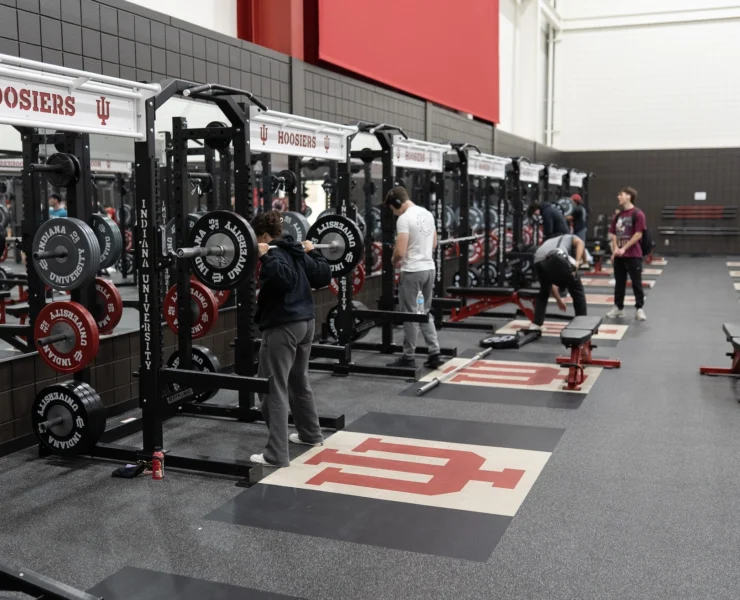 college students lift weights at the Indiana University rec center